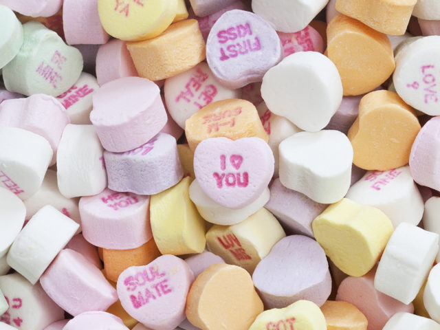 Series of colorful candy hearts with love messages