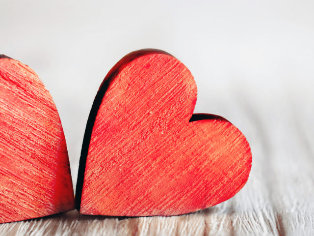Valentines day. Red hearts on wooden background