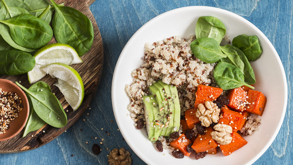 Quinoa with pumpkin, spinach and avocado. Healthy quinoa bowl.