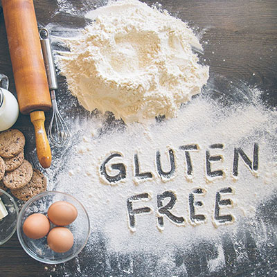Baking background with “Gluten free” writting in flour