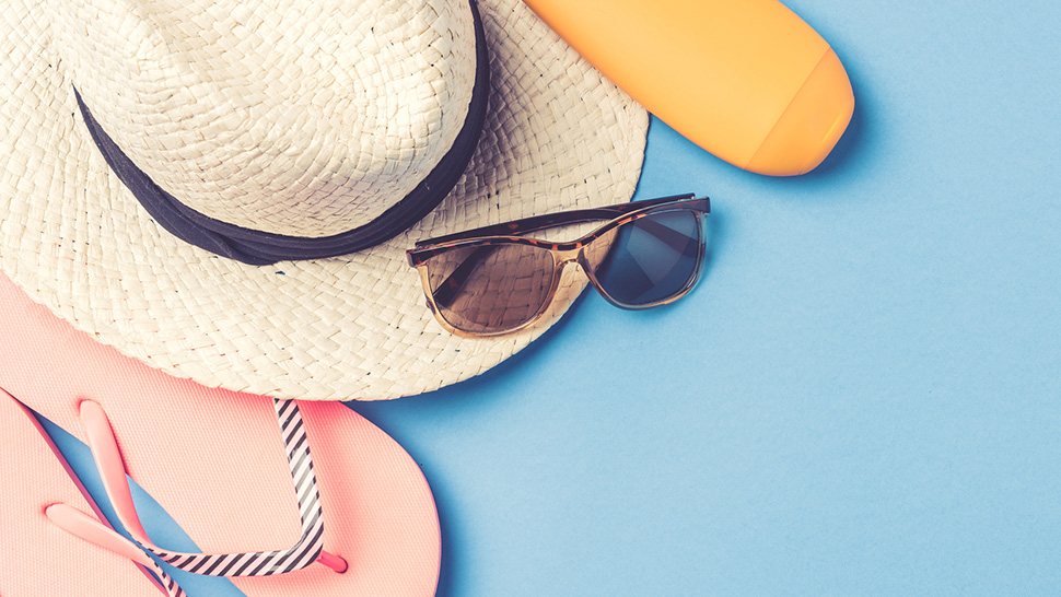 Beach accessories on blue background