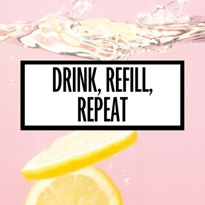 water with lemon on a pink background with a white graphic with the words "drink, refill, repeat" in black writing