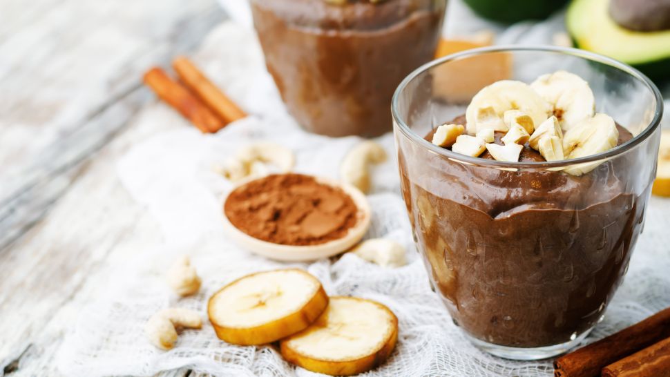 A sweet treat made by little hands—banana-choco pudding with crunchy toppings.