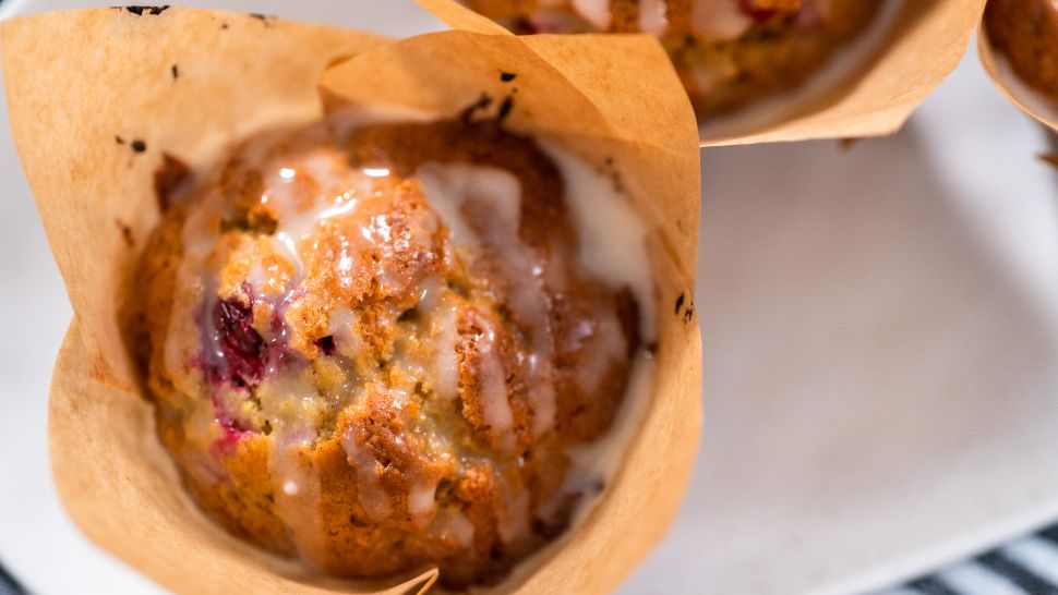 Golden muffin drizzled with icing that looks too good to resist.