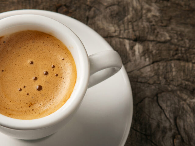 Espresso coffee cup with foam on top view