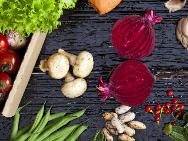 Top view of fresh vegetables on dark background