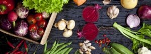 Top view of fresh vegetables on dark background