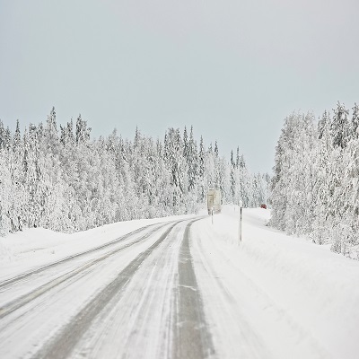 Snow covered road in Finland