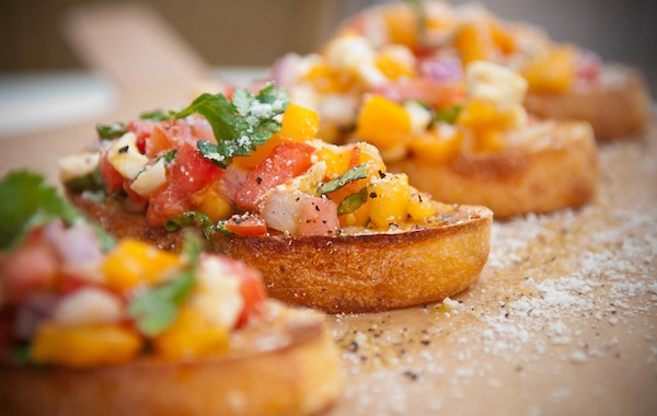 Selective-focus image of Bruschetta with colorful salsa/chutney